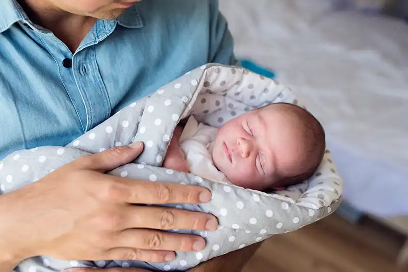 Father holding his baby