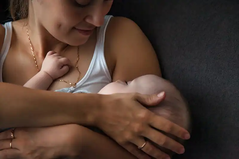 Mother holding her baby