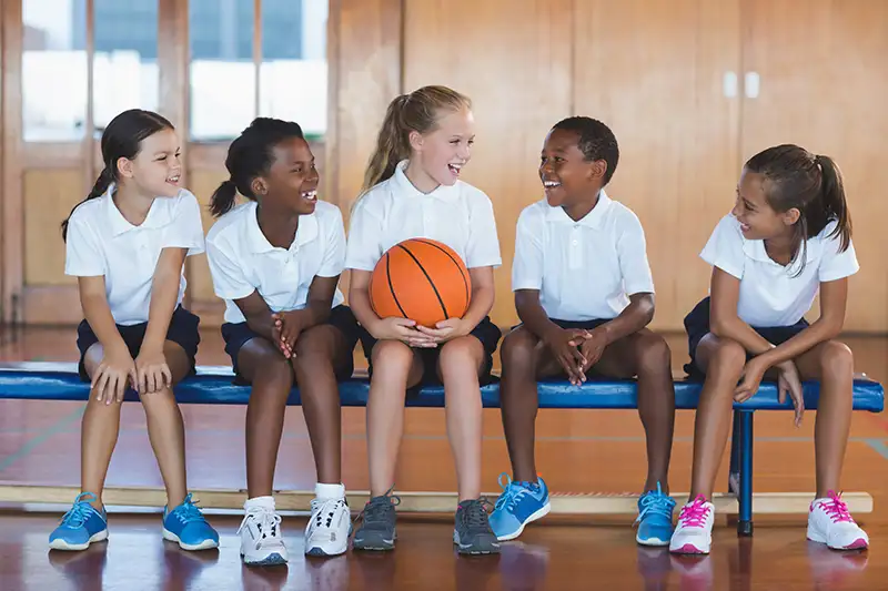 school-kids-having-fun-in-basketball-court